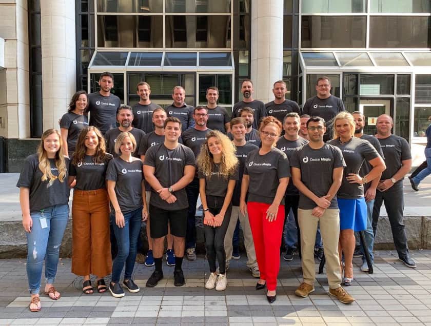 Device Magic team in company t-shirts outside main office in Raleigh