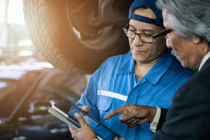 digital maintenance report done by businessmen on a tablet