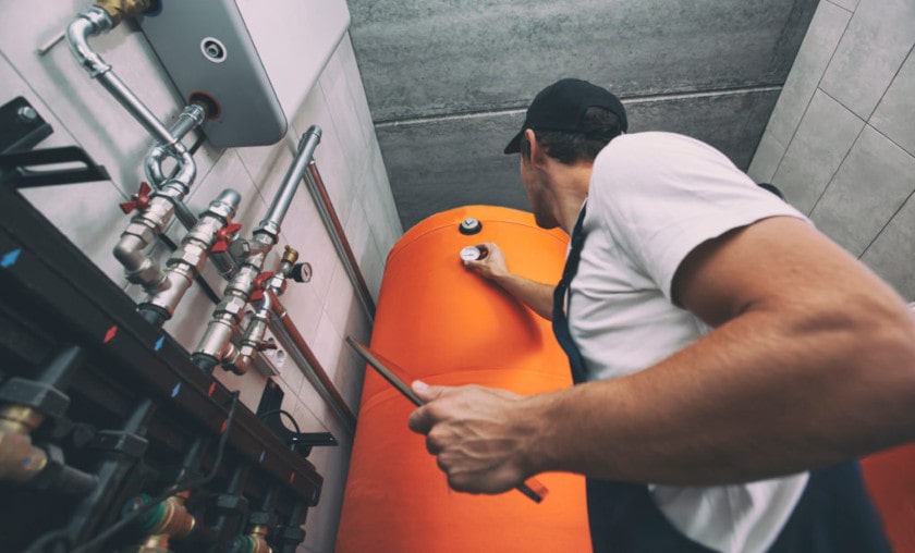 Technician performing plumbing inspection