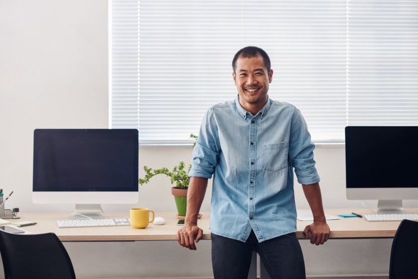 IT professional standing near computer workstations